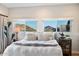 Main bedroom with mountain views and cozy bedding at 8150 N 47Th St, Paradise Valley, AZ 85253