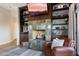 Living area with fireplace and built-in shelving at 8150 N 47Th St, Paradise Valley, AZ 85253