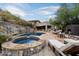 Luxury pool and spa with outdoor fireplace and seating at 8150 N 47Th St, Paradise Valley, AZ 85253