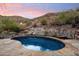 Inviting kidney-shaped pool with flagstone patio; mountain views at 8150 N 47Th St, Paradise Valley, AZ 85253