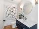 Modern powder room with a sleek vanity and stylish art at 8150 N 47Th St, Paradise Valley, AZ 85253