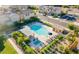 Aerial view of a community pool area with lounge chairs, lush greenery, and a shaded structure at 8535 E Olla Ave, Mesa, AZ 85212