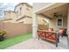 Beautiful covered patio features outdoor seating, ceiling fan and string lights at 8535 E Olla Ave, Mesa, AZ 85212