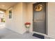 Charming front entry with decorative wreath, potted plants, and a covered porch at 8535 E Olla Ave, Mesa, AZ 85212