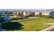 View of a community green space area with a playground and pool surrounded by residential homes at 8535 E Olla Ave, Mesa, AZ 85212