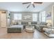 Inviting living room featuring a large sectional sofa, neutral color palette, and plenty of space at 8535 E Olla Ave, Mesa, AZ 85212