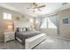 Charming main bedroom features a ceiling fan and well-lit sitting area at 8535 E Olla Ave, Mesa, AZ 85212