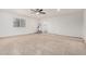 Large bonus room with tile floor and ceiling fan at 8732 W Granada Rd, Phoenix, AZ 85037