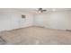 Spacious garage with tile flooring and a/c unit at 8732 W Granada Rd, Phoenix, AZ 85037