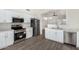 Modern kitchen with stainless steel appliances and white cabinets at 8732 W Granada Rd, Phoenix, AZ 85037