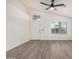 Bright living room with vinyl flooring and a ceiling fan at 8732 W Granada Rd, Phoenix, AZ 85037