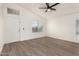 Bright living room with vinyl flooring and a ceiling fan at 8732 W Granada Rd, Phoenix, AZ 85037