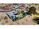 Aerial view of home with pool and putting green, nestled in a community at 10377 W White Mountain Rd, Sun City, AZ 85351