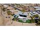 Aerial view showing home with pool, putting green, and solar panels at 10377 W White Mountain Rd, Sun City, AZ 85351