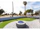 Backyard with firepit and putting green at 10377 W White Mountain Rd, Sun City, AZ 85351