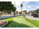 Artificial turf putting green and patio area at 10377 W White Mountain Rd, Sun City, AZ 85351