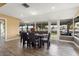 Sun-drenched dining room with golf course view at 10377 W White Mountain Rd, Sun City, AZ 85351