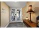 Bright entryway with double doors and wood console table at 10377 W White Mountain Rd, Sun City, AZ 85351