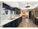 Modern kitchen featuring granite countertops and ample cabinetry at 10377 W White Mountain Rd, Sun City, AZ 85351