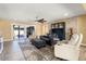 Spacious living room with stone fireplace and comfortable seating at 10377 W White Mountain Rd, Sun City, AZ 85351