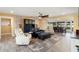 Open living and dining area with a stone accent wall at 10377 W White Mountain Rd, Sun City, AZ 85351