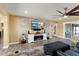 Living room with a fireplace, TV, and access to the pool at 10377 W White Mountain Rd, Sun City, AZ 85351