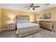 Main bedroom with mirrored headboard and ensuite access at 10377 W White Mountain Rd, Sun City, AZ 85351