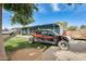 Home exterior showing the yard with an off-road vehicle in the driveway at 10433 E Boise St, Apache Junction, AZ 85120