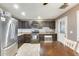 Well-lit kitchen featuring stainless steel appliances, tiled floors, and a view to the backyard at 10433 E Boise St, Apache Junction, AZ 85120