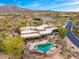 Aerial view of a luxurious Southwestern-style home with a private pool and spa at 10712 E Prospect Point Dr, Scottsdale, AZ 85262