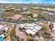 Overhead shot of a sprawling estate with a pool, nestled within a desert landscape at 10712 E Prospect Point Dr, Scottsdale, AZ 85262