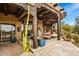 Inviting covered patio featuring stone flooring and stylish lounge seating, perfect for outdoor relaxation at 10712 E Prospect Point Dr, Scottsdale, AZ 85262