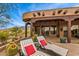 Outdoor patio with lounge chairs, desert views, and a charming seating area at 10712 E Prospect Point Dr, Scottsdale, AZ 85262