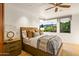 Bedroom with a large window offering views of mountains and desert landscape at 10712 E Prospect Point Dr, Scottsdale, AZ 85262