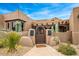 Charming Southwestern style home entrance featuring desert landscaping and a brick pathway at 10712 E Prospect Point Dr, Scottsdale, AZ 85262