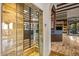 View of modern kitchen with a glass encased wine cellar at 10712 E Prospect Point Dr, Scottsdale, AZ 85262