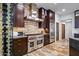 Modern kitchen features stainless steel appliances, a wine rack, and wood cabinetry at 10712 E Prospect Point Dr, Scottsdale, AZ 85262