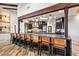 Large kitchen with an extended bar, stainless appliances, and decorative lighting at 10712 E Prospect Point Dr, Scottsdale, AZ 85262