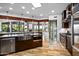 Spacious kitchen with stainless steel appliances, large island, and natural lighting from skylight at 10712 E Prospect Point Dr, Scottsdale, AZ 85262