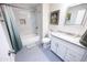 Bathroom with tiled shower and granite vanity at 10906 W Boswell Blvd, Sun City, AZ 85373