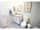 Clean bathroom features granite counters, dual mirrors and a stylish framed art piece hanging on the wall at 10906 W Boswell Blvd, Sun City, AZ 85373