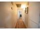 Hallway with wood-look flooring leading to other rooms in the house at 10906 W Boswell Blvd, Sun City, AZ 85373