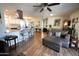 Bright, open living area with a kitchen island and bar stools, creating a seamless flow at 10906 W Boswell Blvd, Sun City, AZ 85373