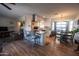 Open-concept living space blending a modern kitchen with a cozy living area and dining nook at 10906 W Boswell Blvd, Sun City, AZ 85373