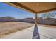 View of the backyard showing the covered patio and block wall at 1203 E Judi St, Casa Grande, AZ 85122