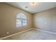 Bedroom featuring neutral carpet, fresh paint, and a window providing natural light at 1203 E Judi St, Casa Grande, AZ 85122