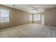 Large bedroom with three windows providing natural light, neutral carpet and fan at 1203 E Judi St, Casa Grande, AZ 85122