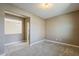 Bedroom featuring tile floors and a neutral carpet with open doorway into a living space at 1203 E Judi St, Casa Grande, AZ 85122