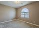 Cozy bedroom featuring neutral carpet, fresh paint, and a window providing natural light at 1203 E Judi St, Casa Grande, AZ 85122