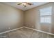 Clean bedroom featuring neutral carpet, fresh paint, and a window providing natural light at 1203 E Judi St, Casa Grande, AZ 85122